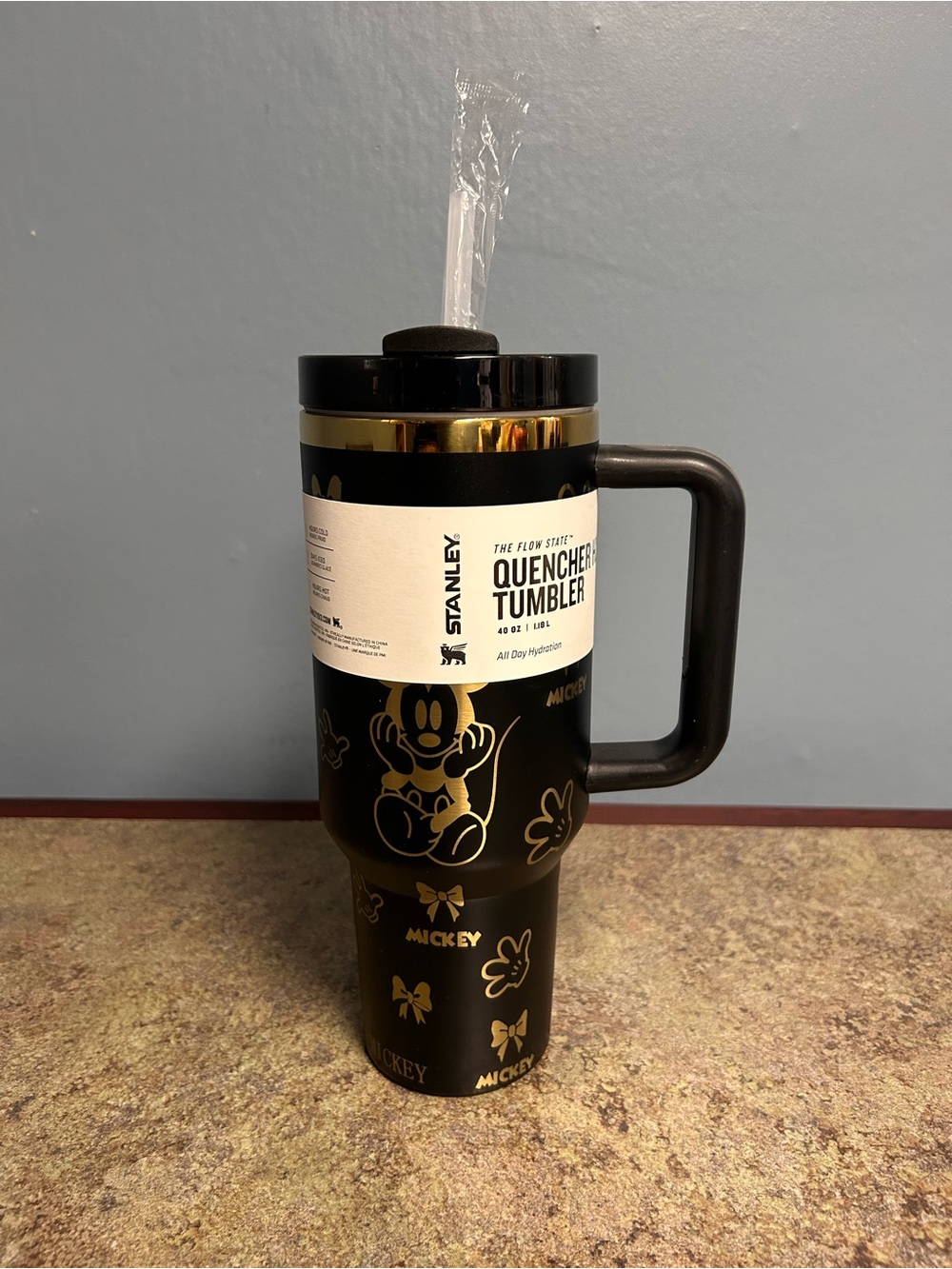 Stanley Black and Gold Travel Tumbler with Character Accents